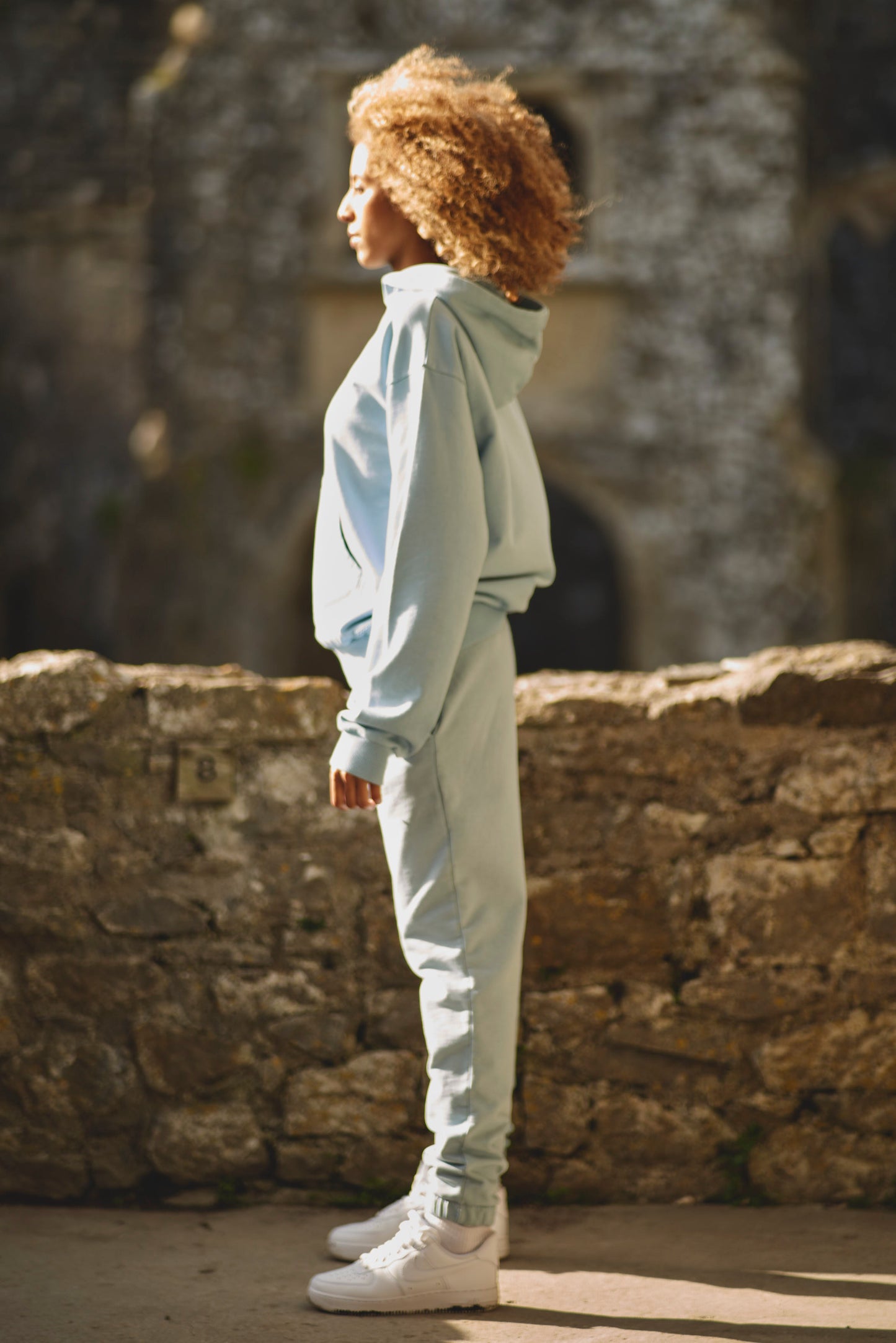 side view of blue luxury womens tracksuit