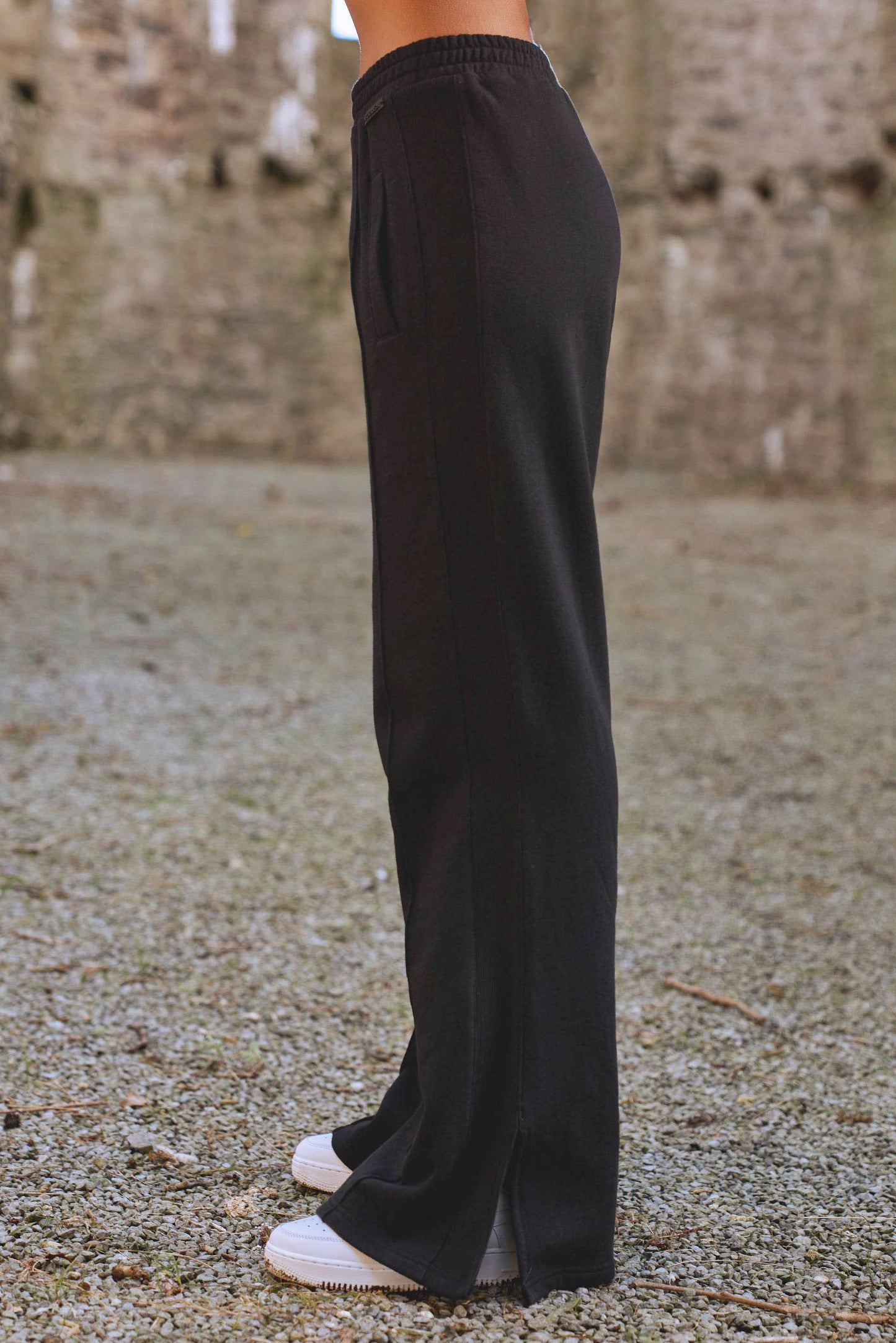 side view of luxury womens joggers in black