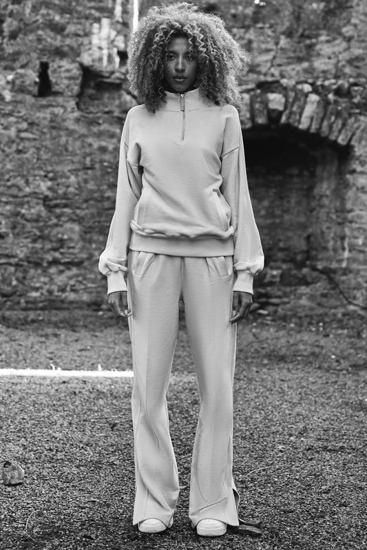 full front view of luxury womens tracksuit in cream