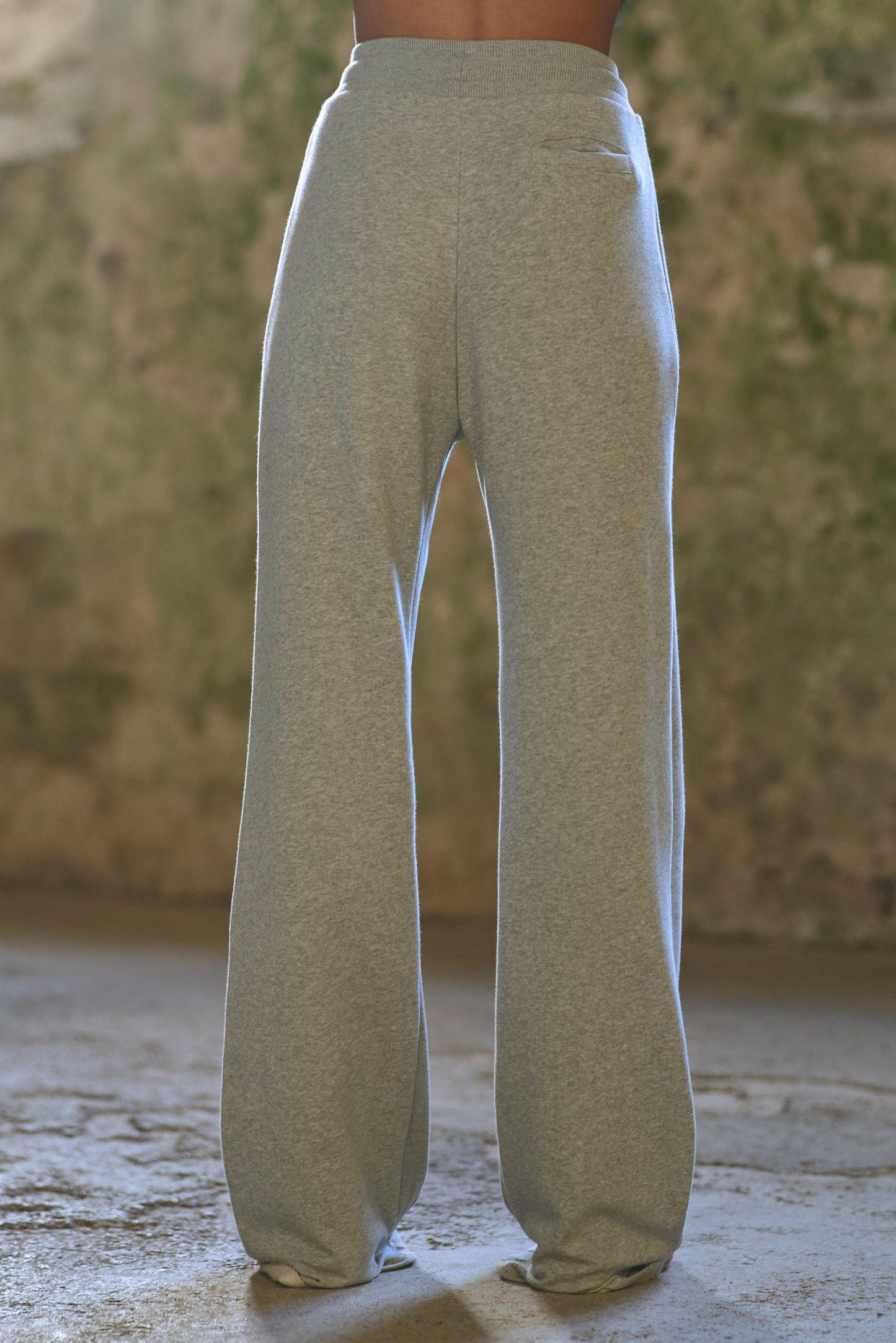 back view of model wearing womens grey joggers