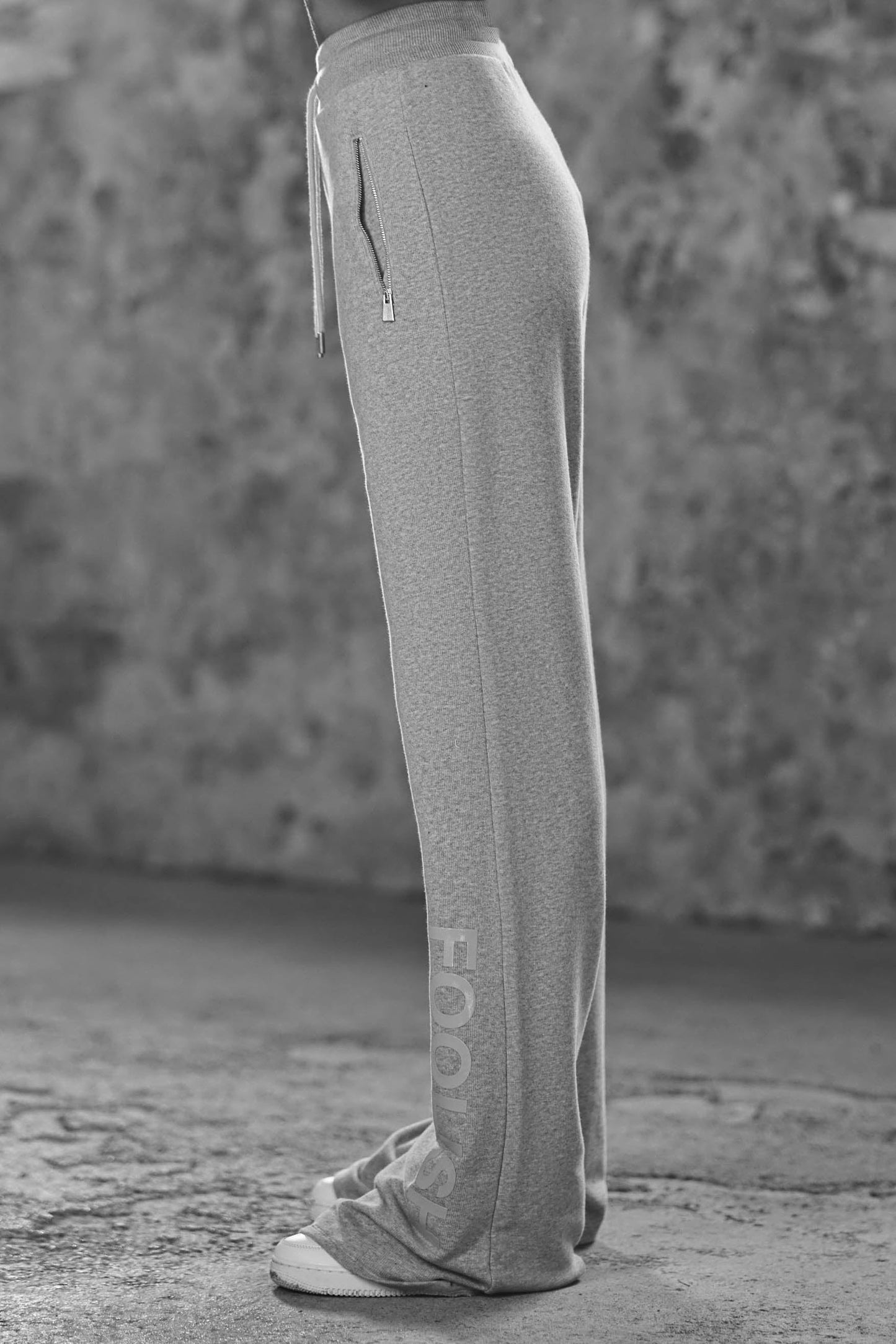 side view of model wearing wide leg womens joggers in grey