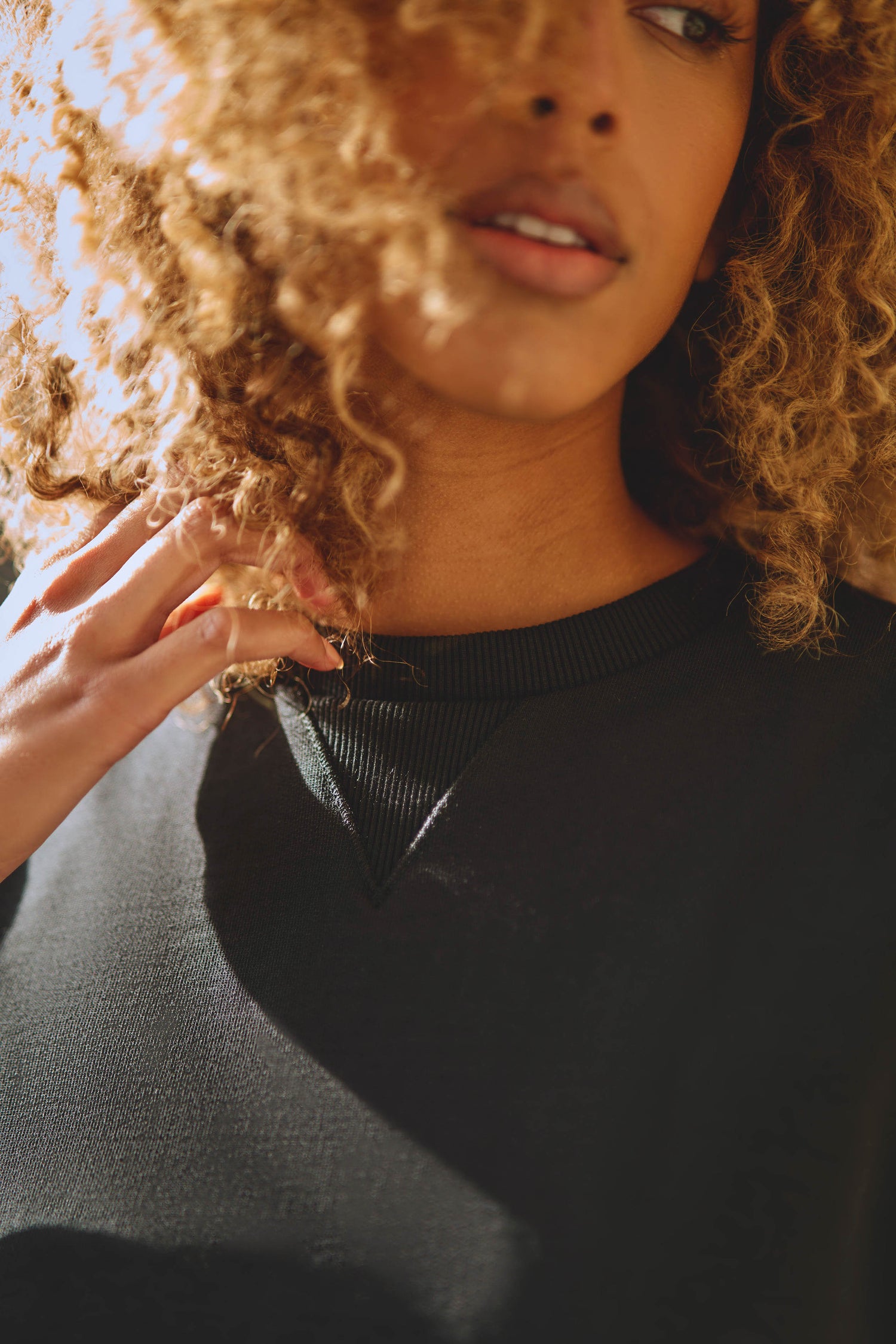 close up detail of neckline on luxury womens t-shirt in black