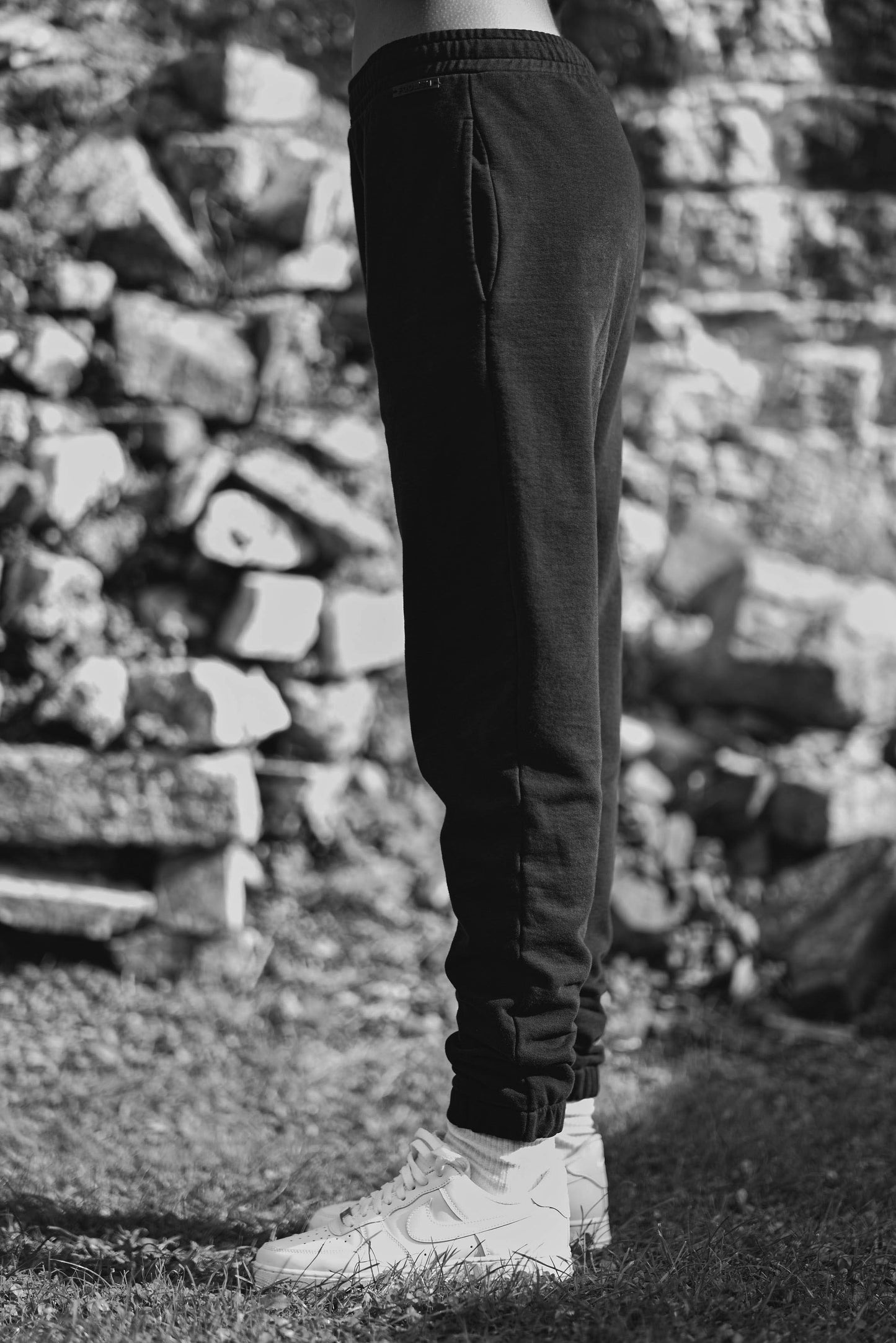 side view of womens luxury black joggers