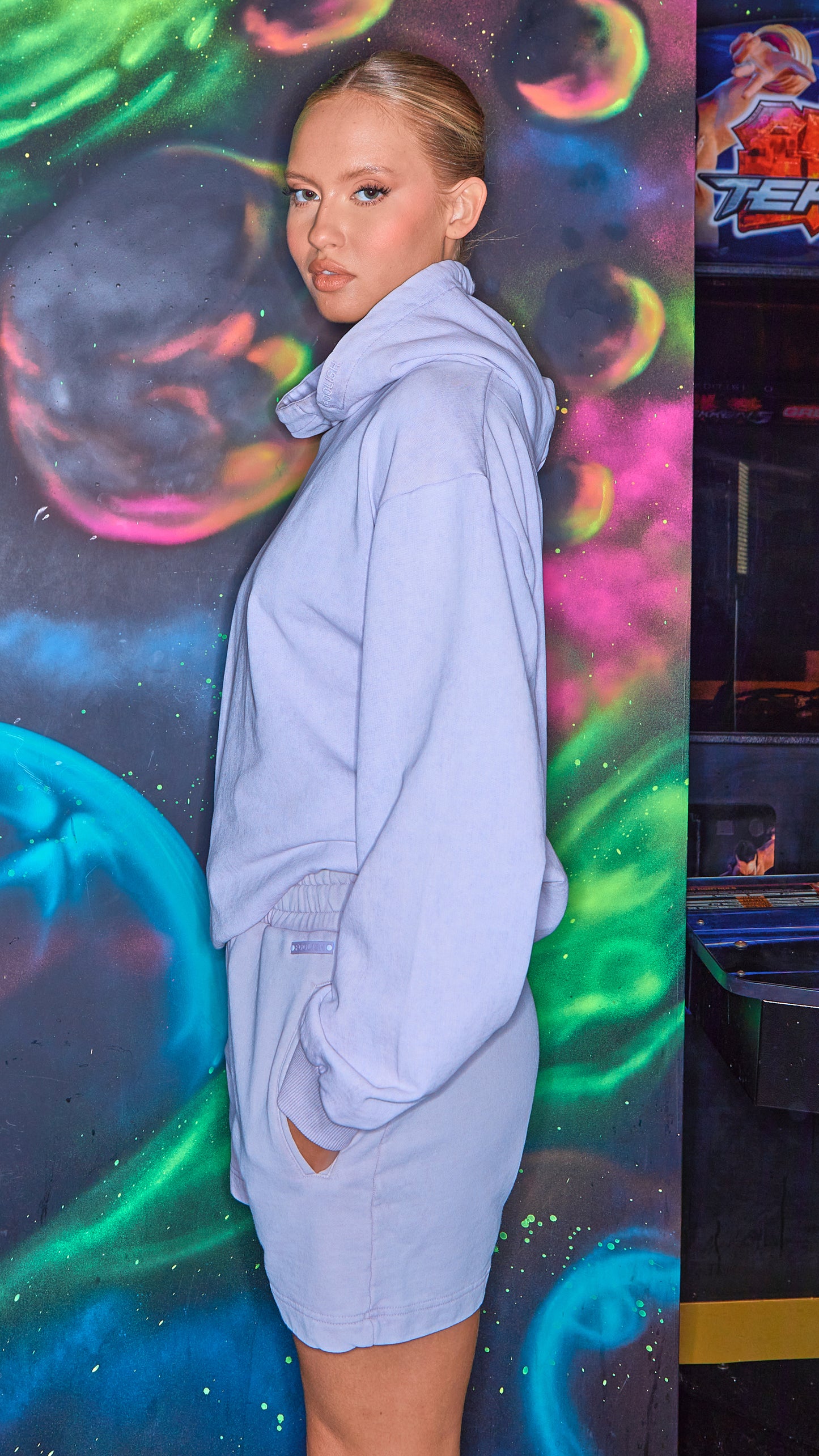 side view of luxury womens shorts and hoodie in lilac