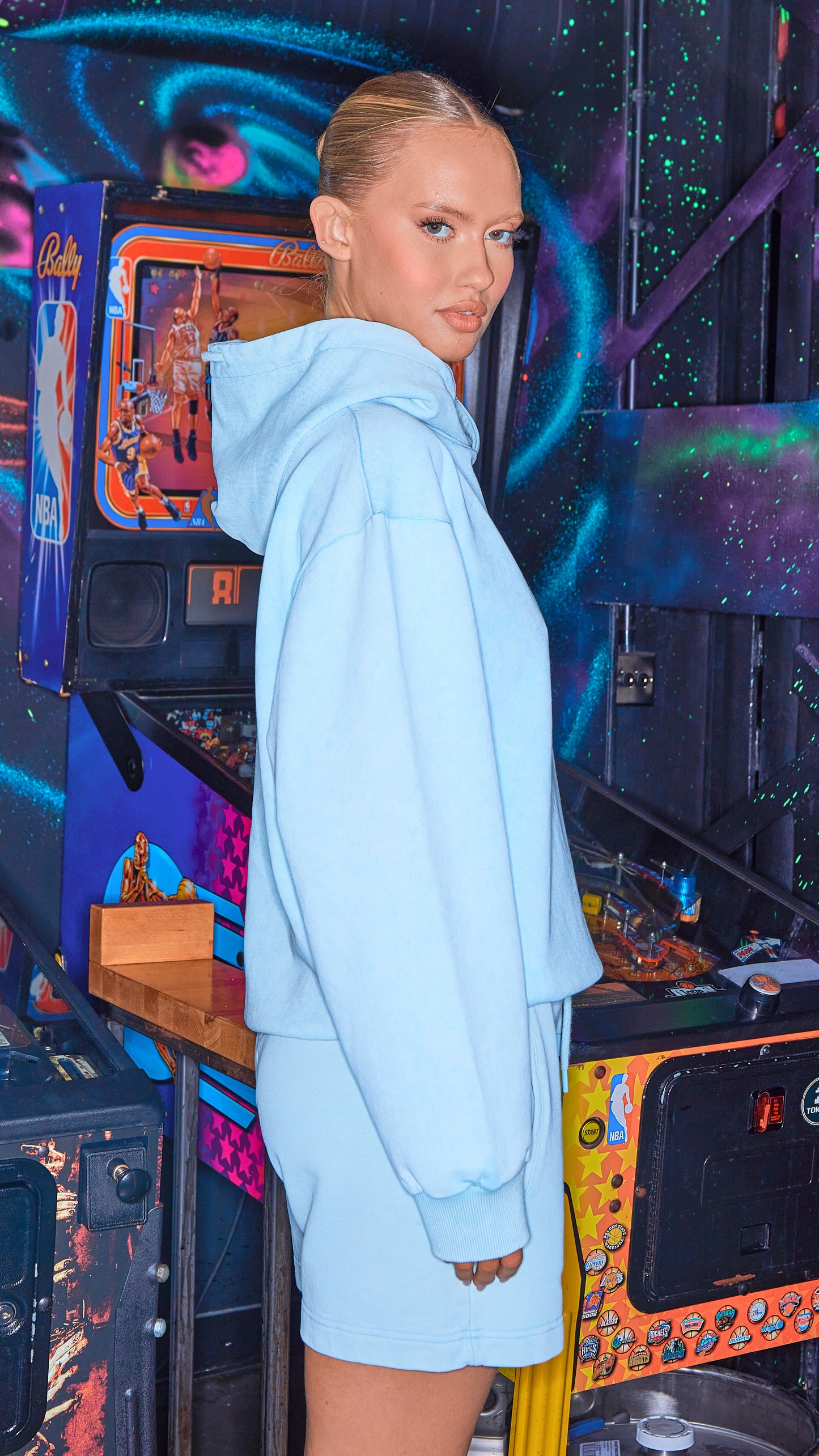 side view of womens luxury hoodie and shorts in chalk blue