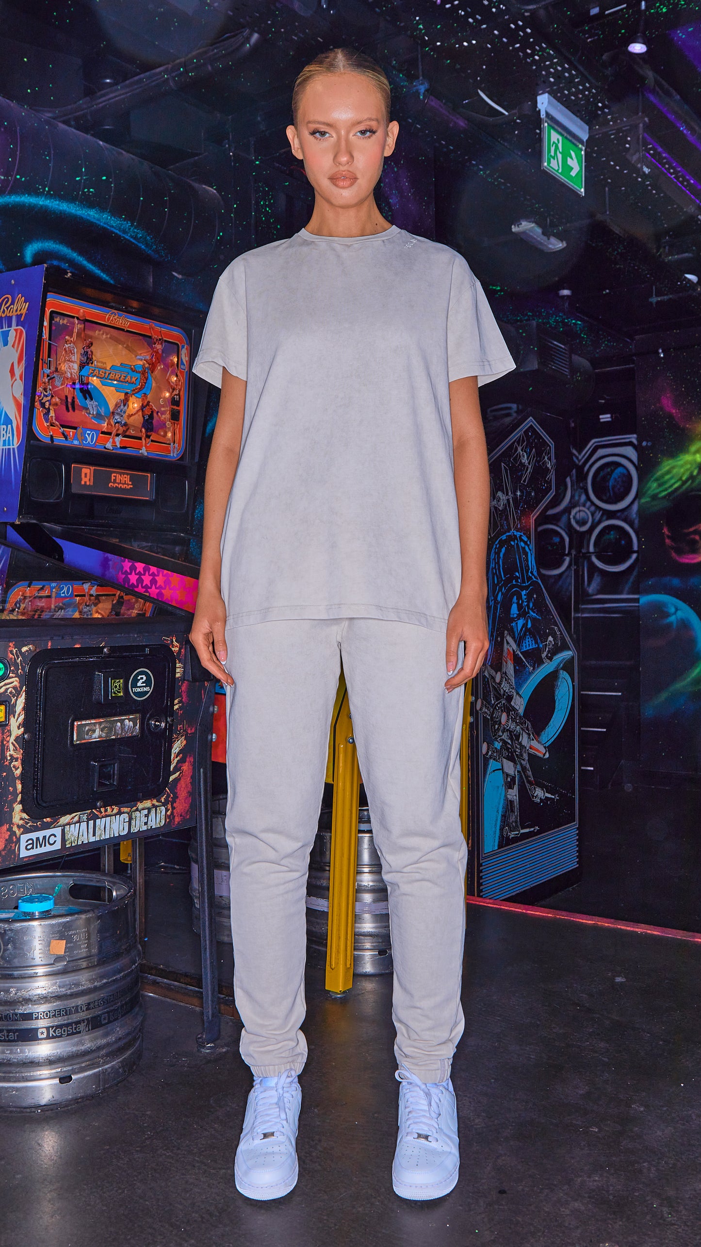 full length shot of model wearing womens joggers and matching tshirt in stone