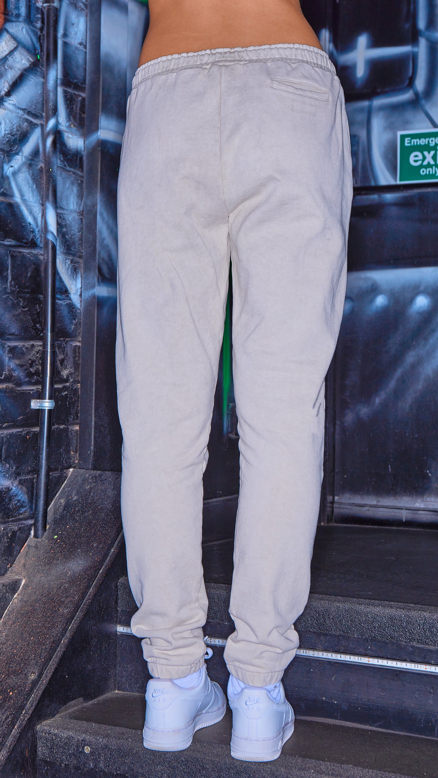 back view of womens joggers in the shade stone