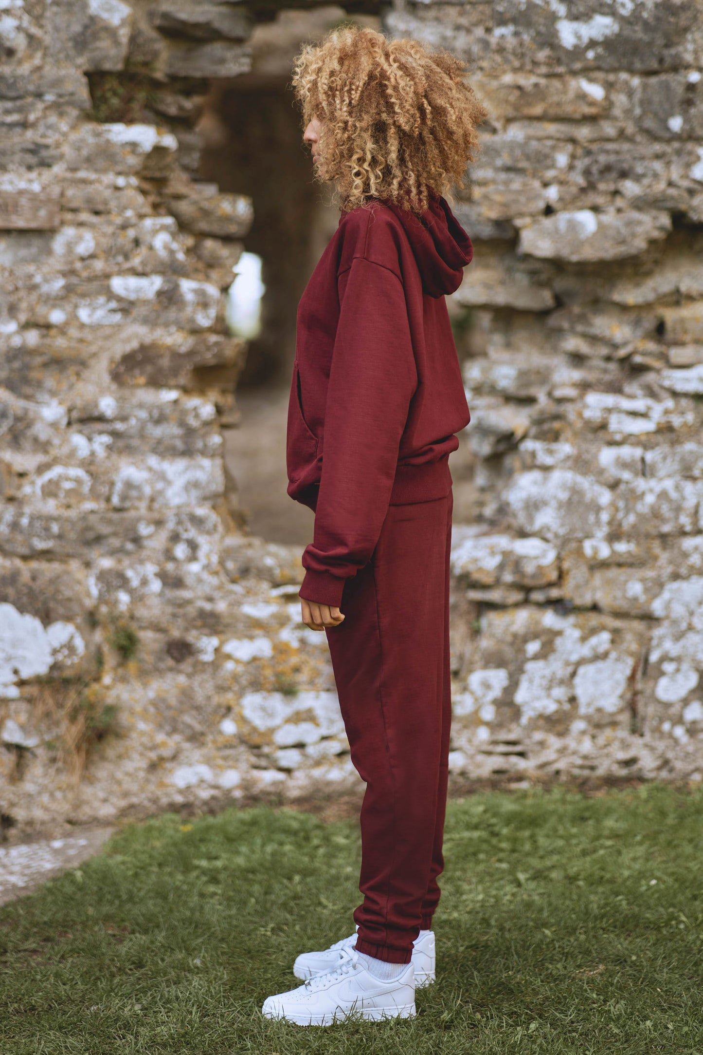 side view of core luxury womens tracksuit in burgundy