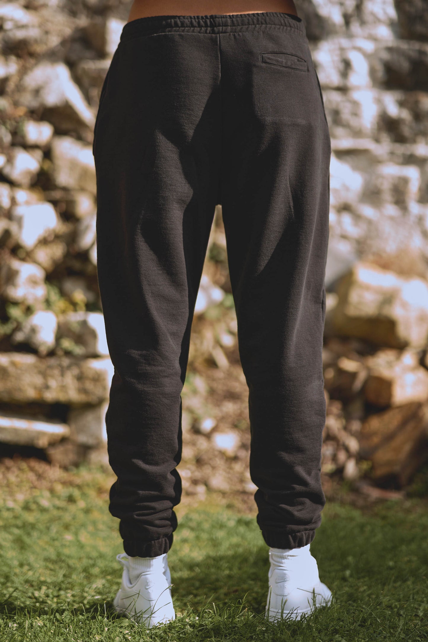back view of luxury womens black joggers