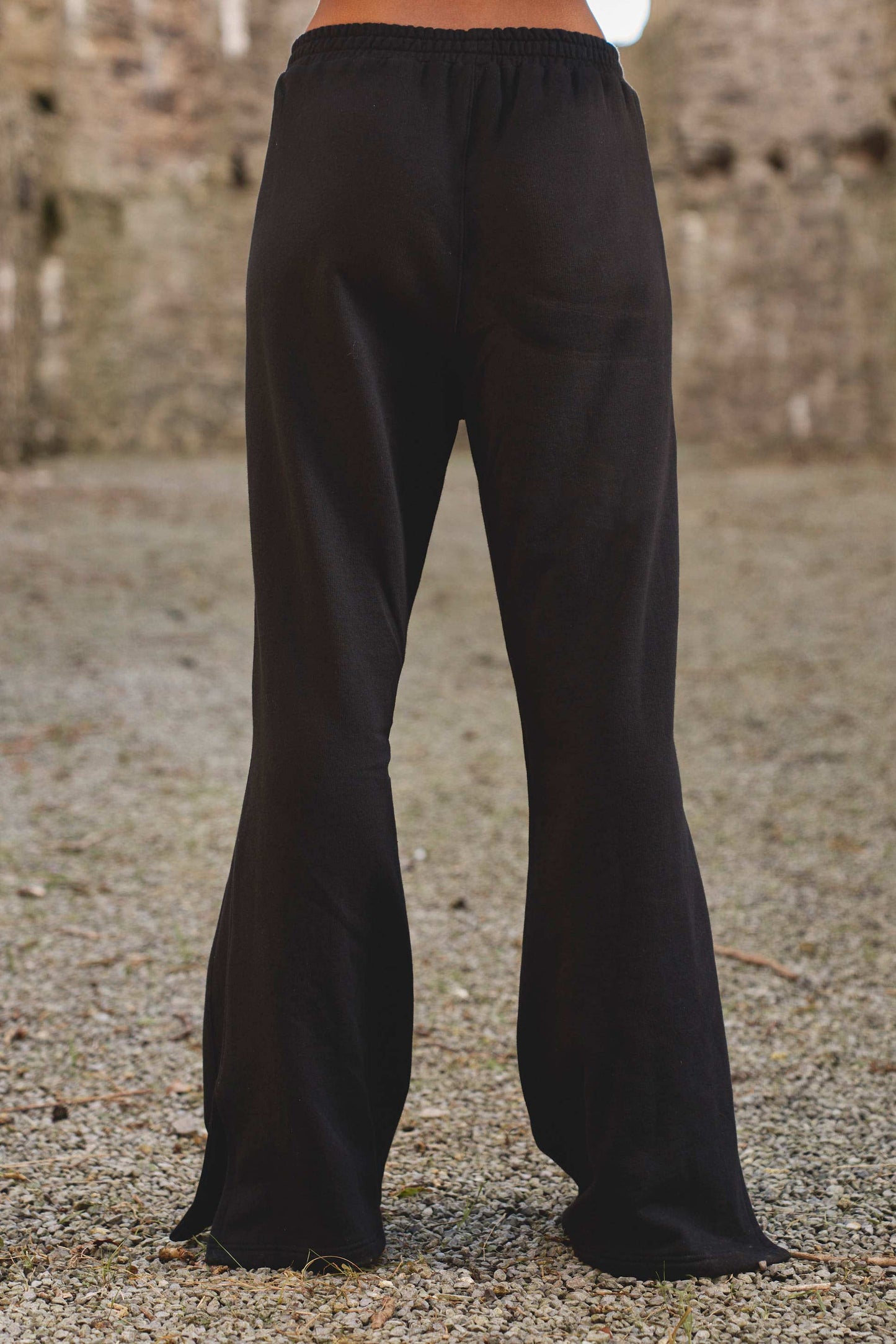back view of luxury womens track joggers in black