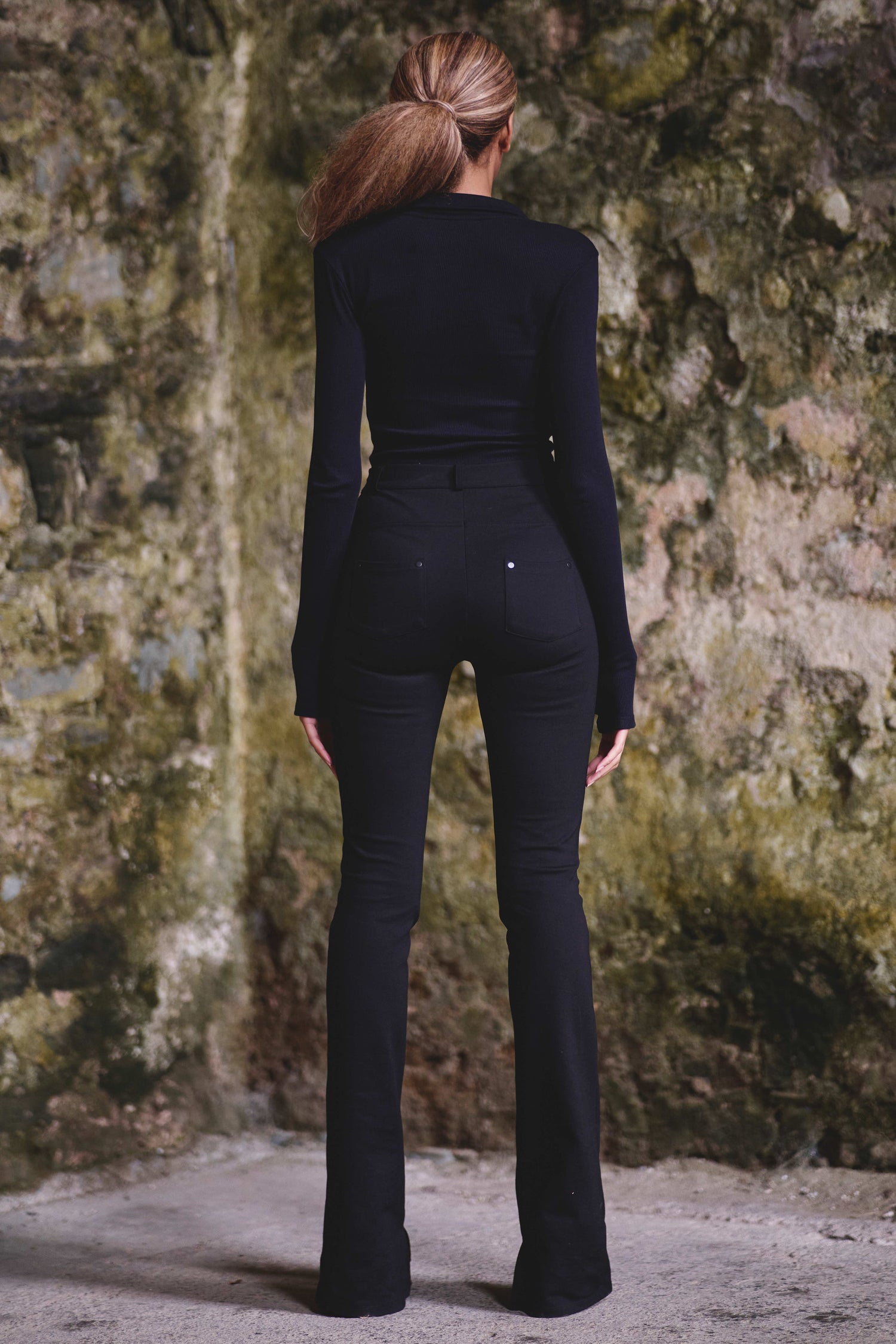 back view of organic bodysuit in black with long sleeves