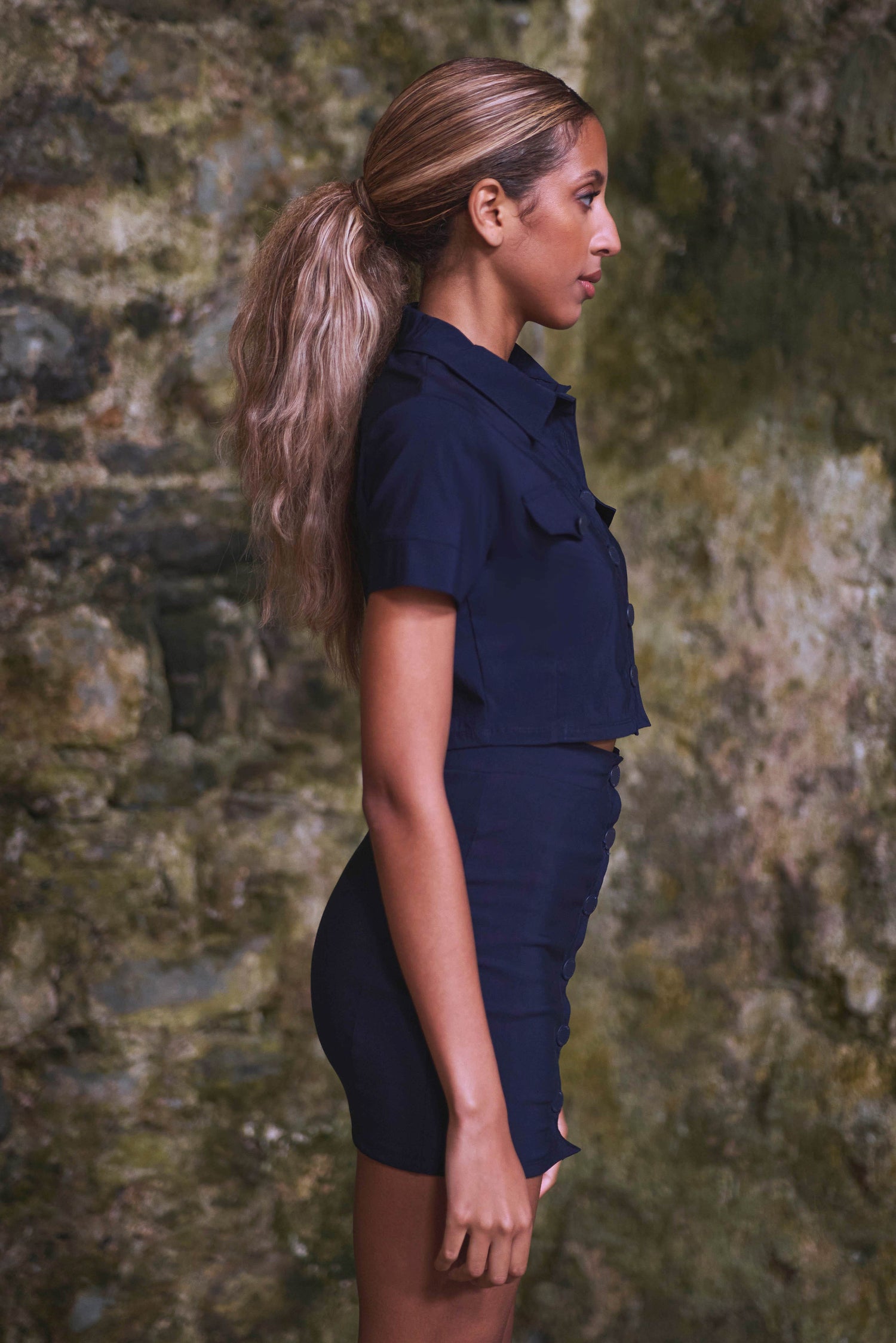 side view of womens organic crop top and skirt in navy