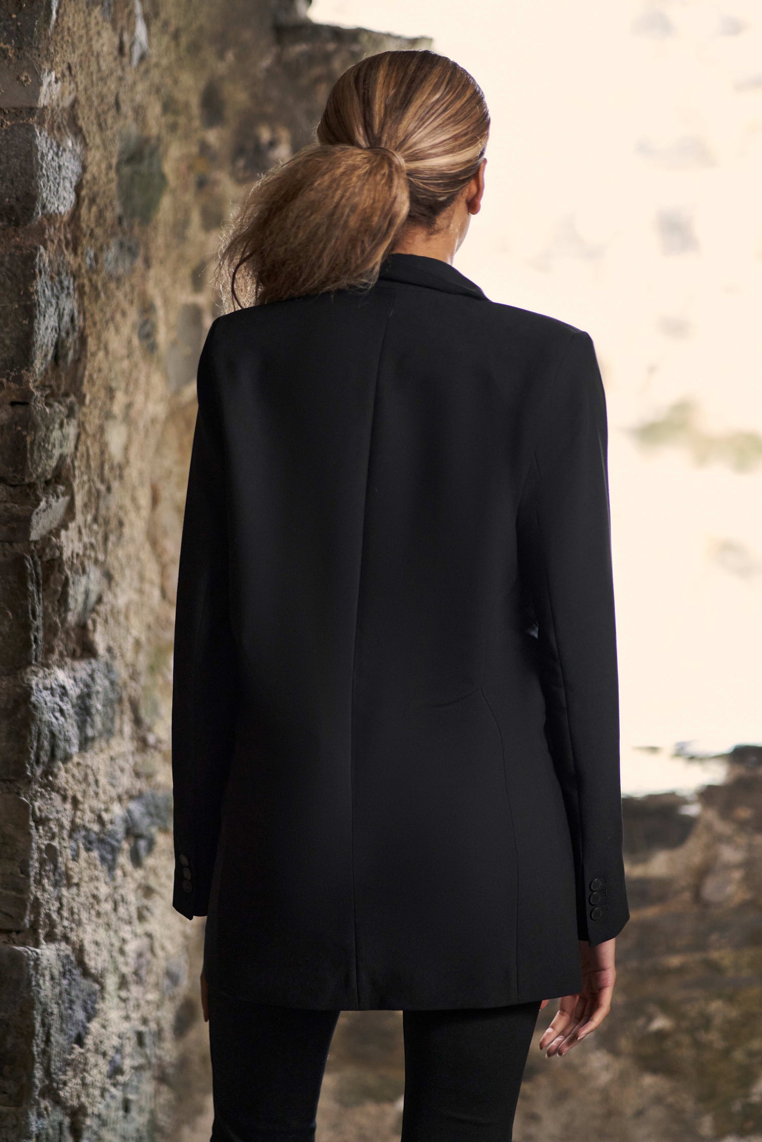 back view of womens luxury blazer in black