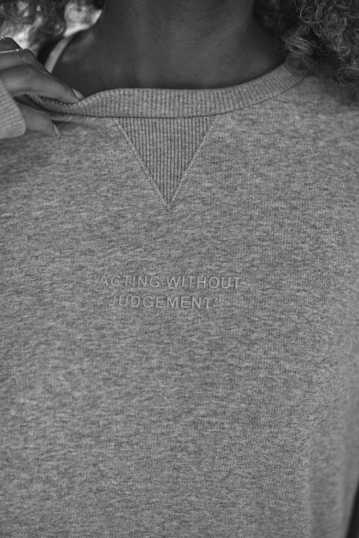 close up detailing on luxury womens sweatshirt in grey