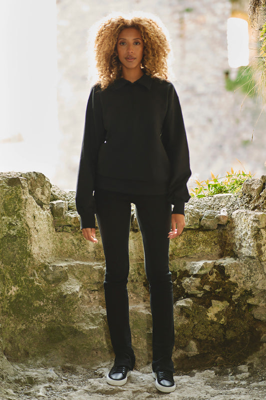full length shot of model wearing luxury sweatshirt in black with black pants