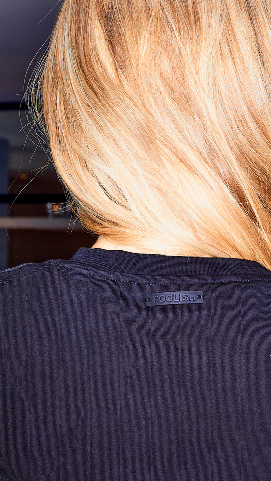back branded detailing on black luxury womens t-shirt