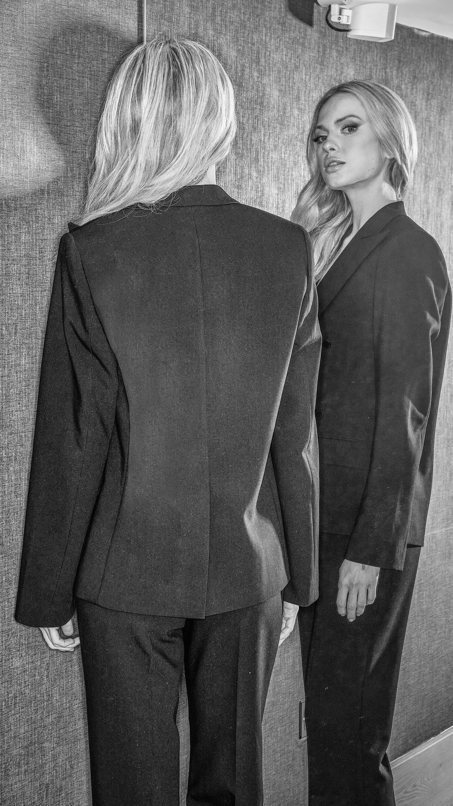 back view of womens luxury blazer and trousers