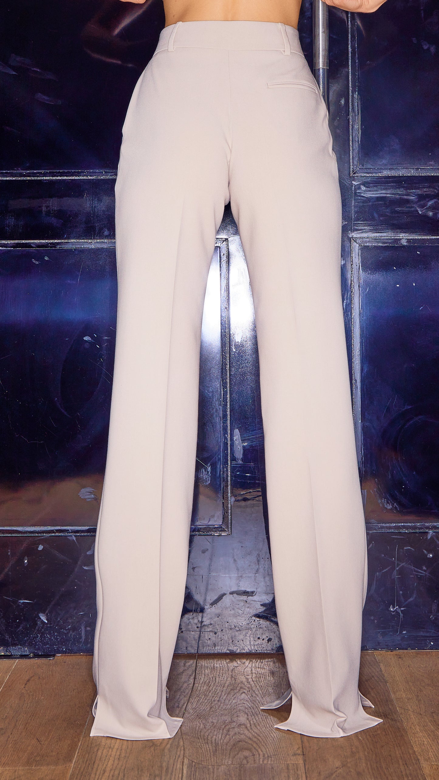 back view of womens luxury trousers in stone