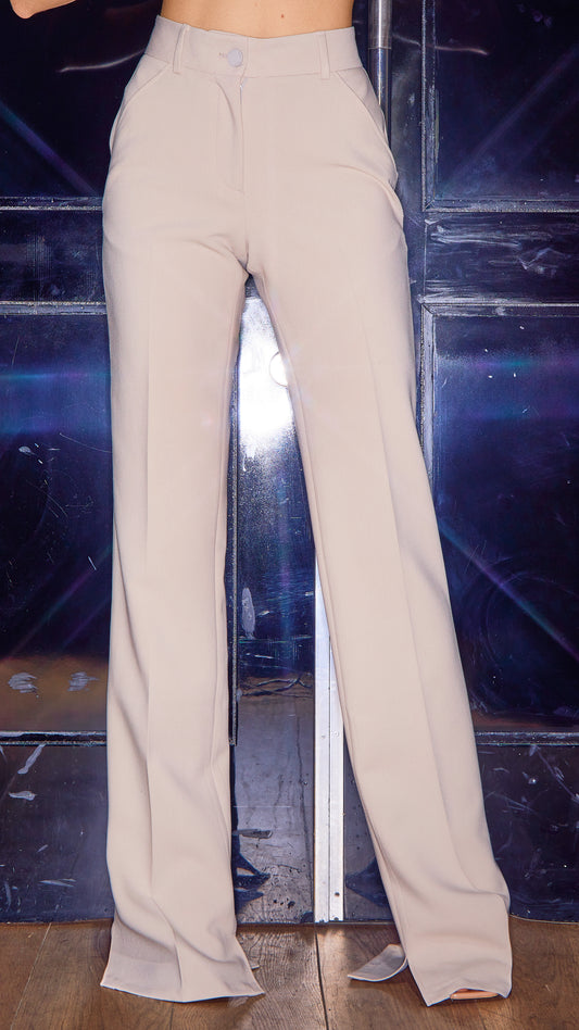 model wearing womens luxury trousers in stone