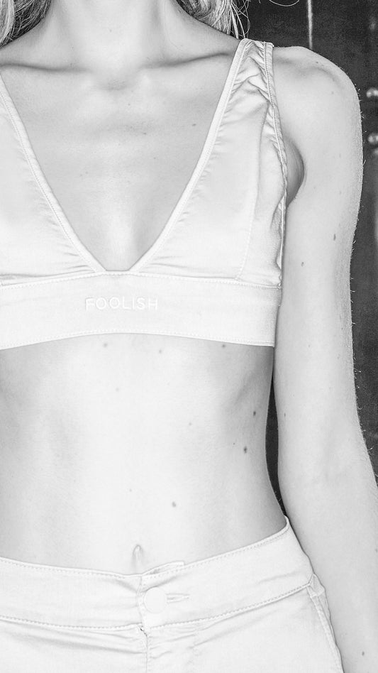 close up image of womens organic cotton crop top in stone
