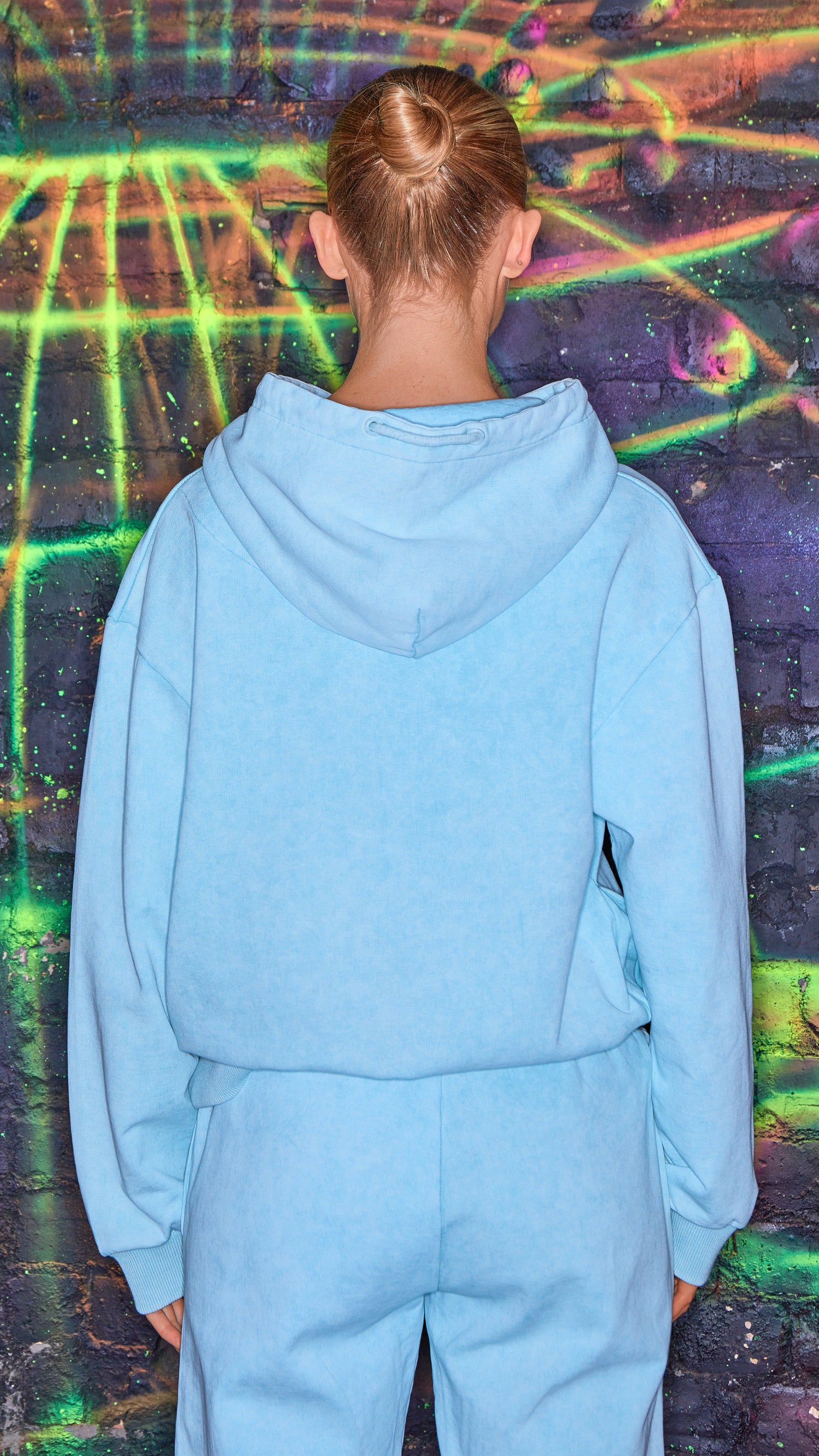 back view of luxury womens tracksuit in chalk blue