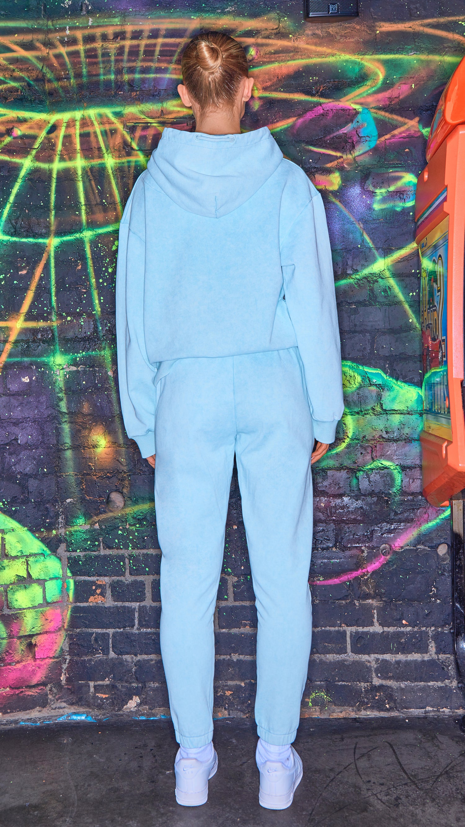 back view of womens luxury tracksuit in chalk blue