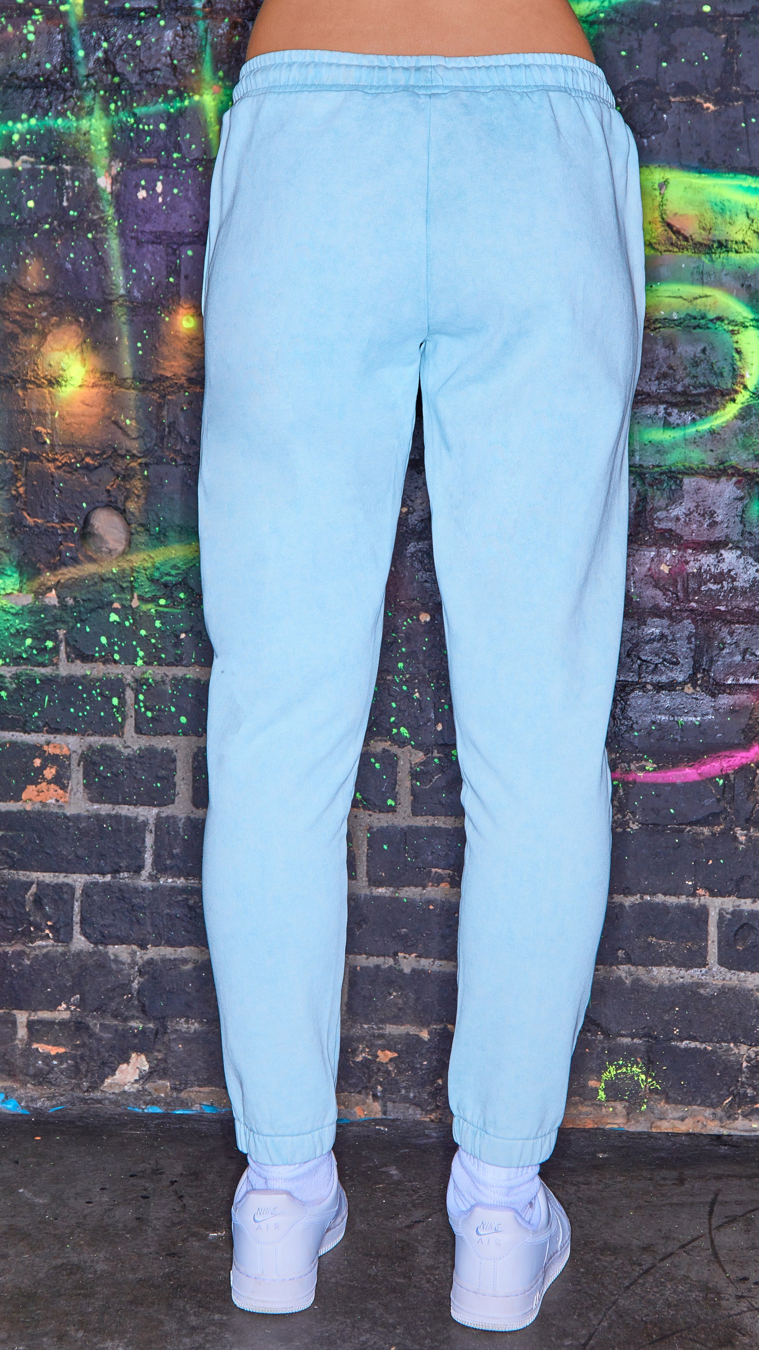 back view of womens luxury joggers in chalk blue