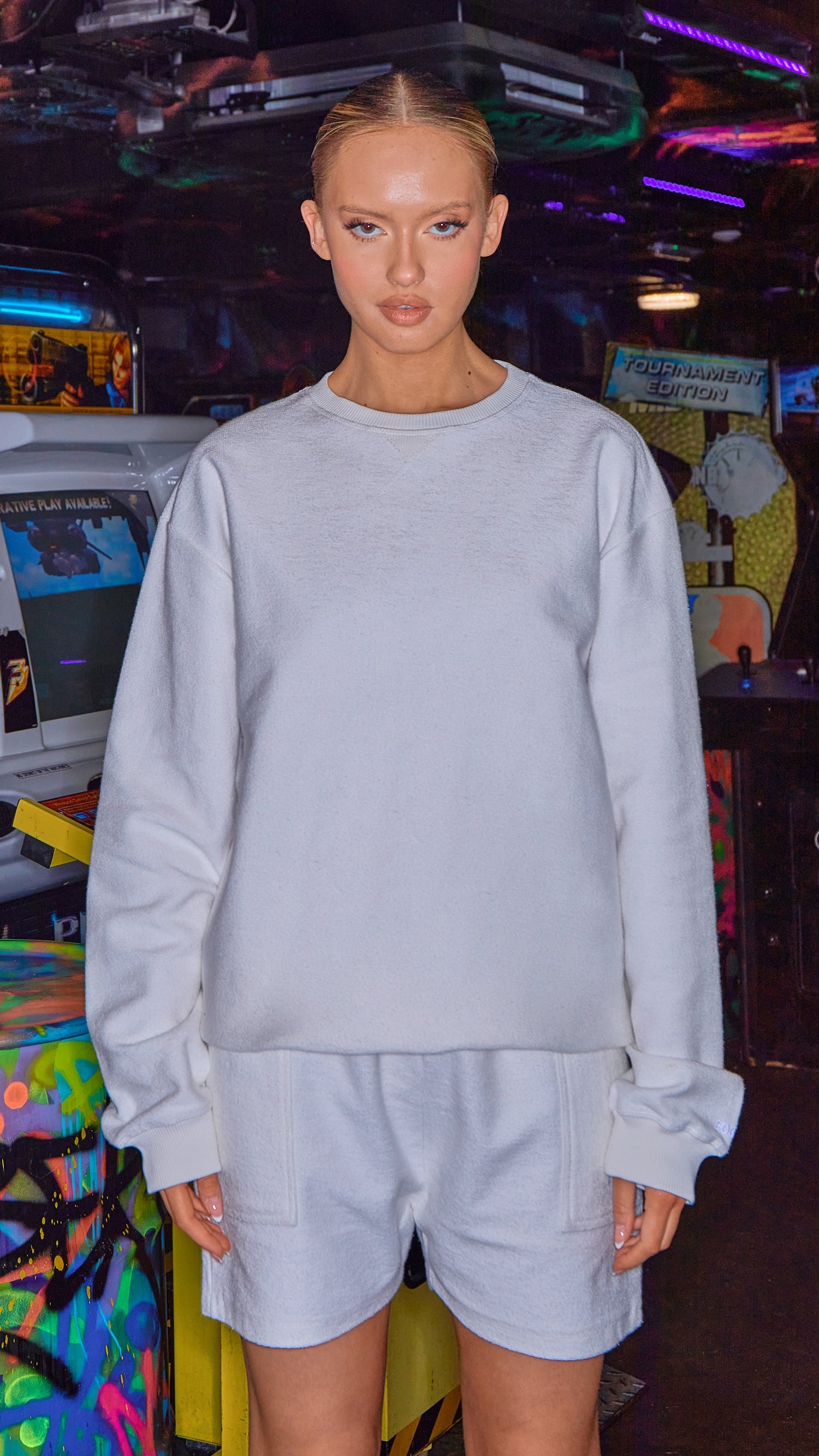 model wearing womens white organic sweatshirt and matching shorts